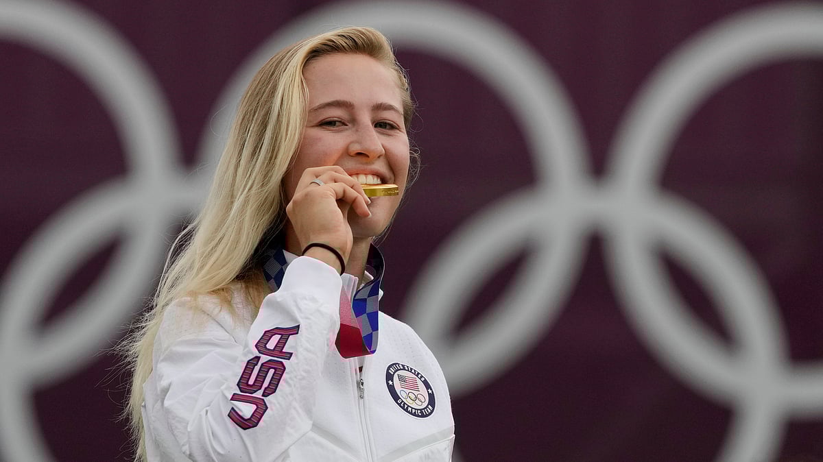  (AP Photo/Andy Wong, File) : FILE - Nelly Korda, of the United States, bites her gold medal of the women's golf event at the 2020 Summer Olympics, Saturday, Aug. 7, 2021, at the Kasumigaseki Country Club in Kawagoe, Japan. Korda will be a strong favorite to win another gold at the Paris Games.

